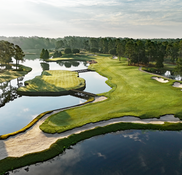 king north golf course with green field, river 