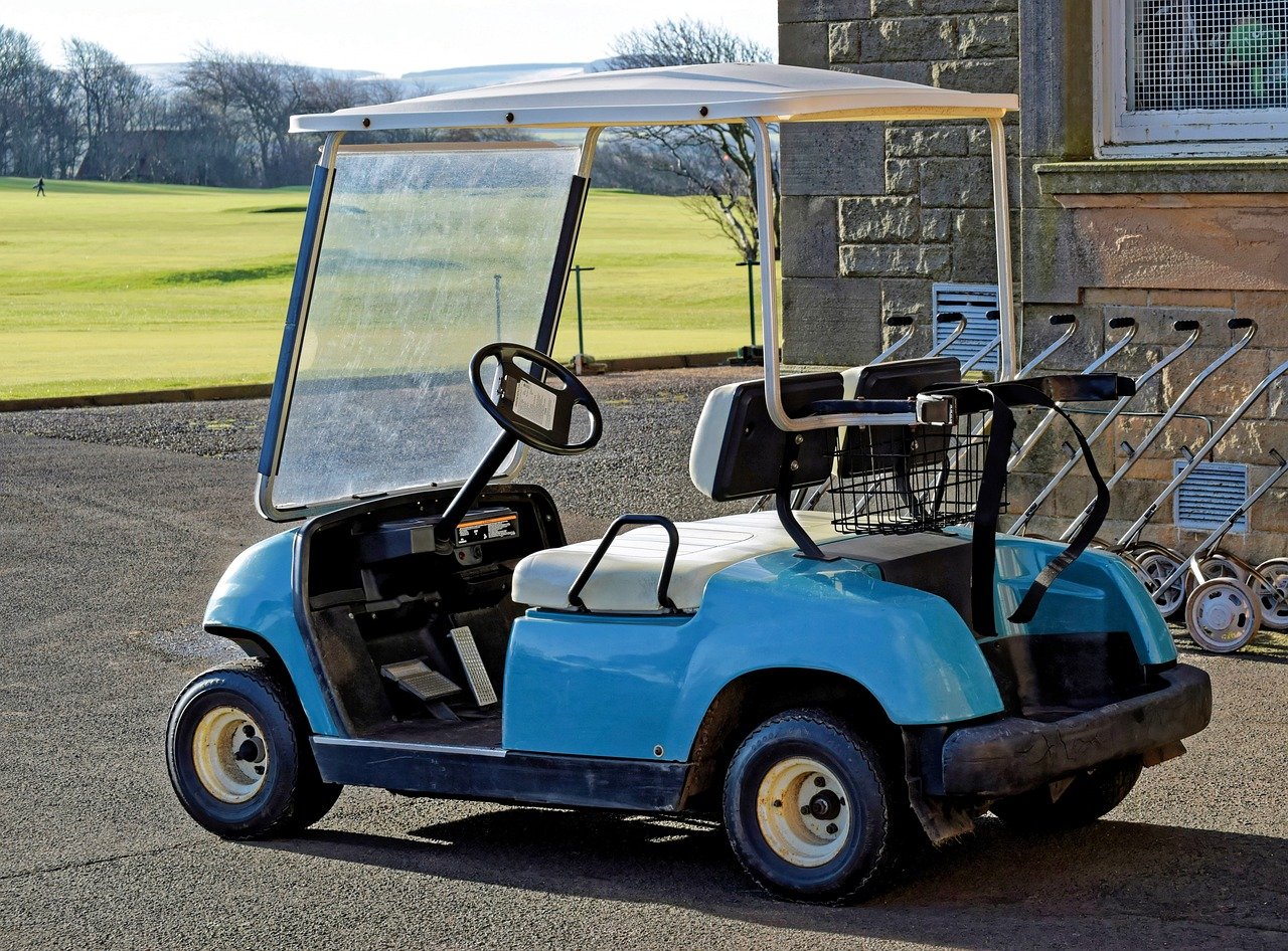 Blue golf cart in golf course