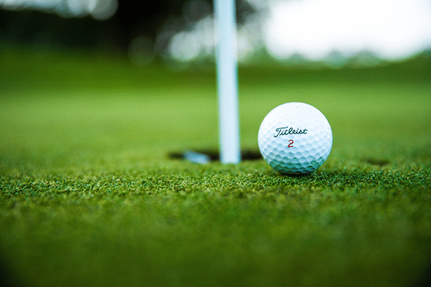 Picture2 - Green Golfing Genius a golf ball near to hole with flag