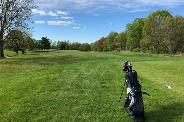 Mohansic golf course with beautiful view of trees and a golf bag in the golf course. 