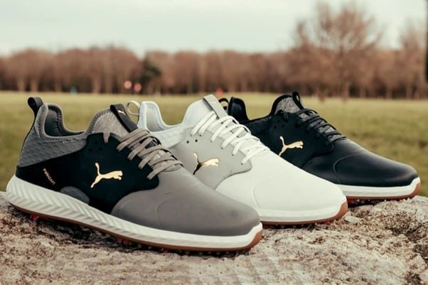 Puma Ignite PWRADAPT shoes where one shoes is black and silver, one white, one black